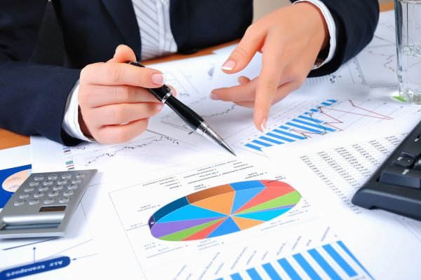Workplace businessman. Charts, securities, charts on your desktop